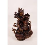 A Sino-Tibetan bronze figure of two gods coupling, impressed double vajra mark to base, 8½" high