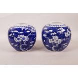 A pair of Chinese blue and white porcelain ginger jars with cracked ice and prunus blossom