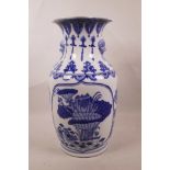 A Chinese blue and white porcelain vase with a petal shaped rim and two lion mask handles, decorated