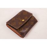 A Louis Vuitton style wallet, 4" x 4"