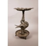 A Chinese mixed metal candlestick stand in the form of a phoenix, decorated with scrolling