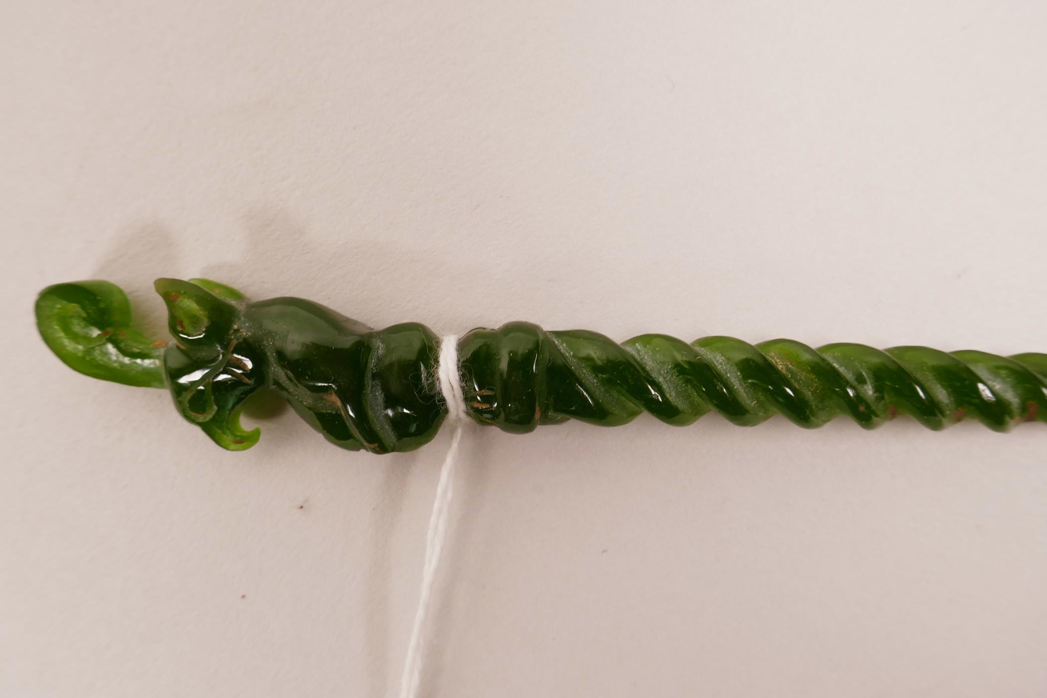 A Chinese green hardstone hair pin with a spiral stem and carved mythical creature to end, 7½" long - Image 2 of 2