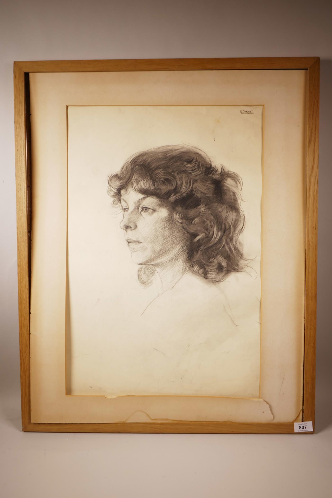 E. Siegel (Mid C20th), Female Portrait, signed upper right, charcoal on paper, glass missing from - Image 2 of 5