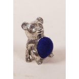 A silver pincushion in the form of a bear, 1"