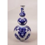 A Chinese blue and white porcelain triple gourd vase, seal mark to base, 7½" long