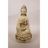 A Chinese blanc de chine Quan Yin seated on a lotus throne, impressed seal mark verso, 10½" high