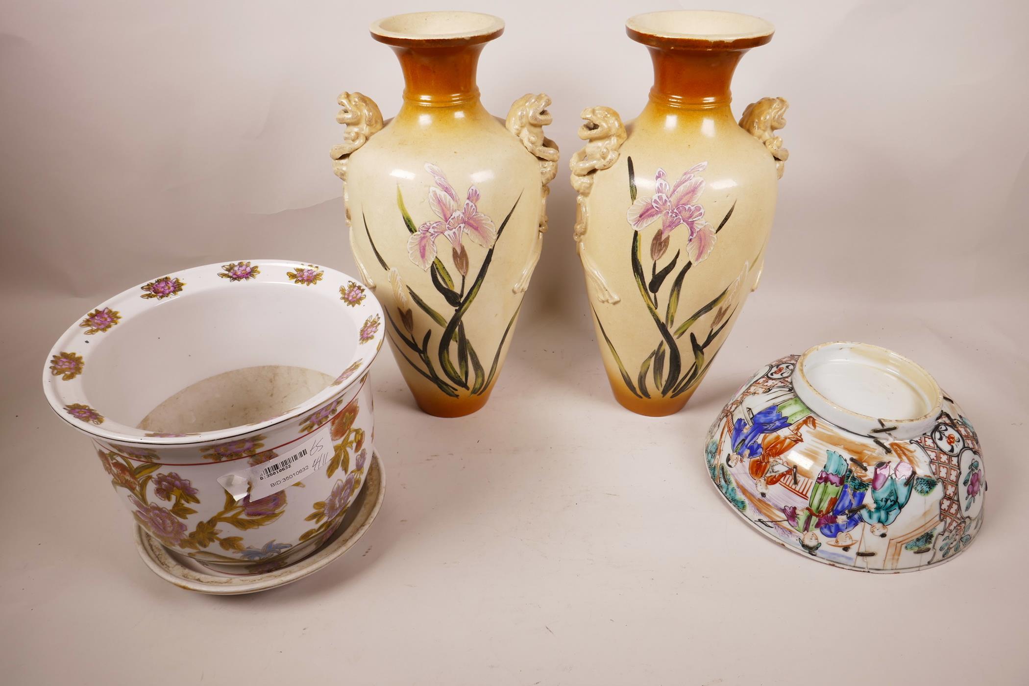 A pair of Japanese porcelain vases with lion's mask handles, 12" high, painted with irises, together