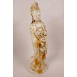 A Chinese white jade figurine of Quan Yin, 11½" high