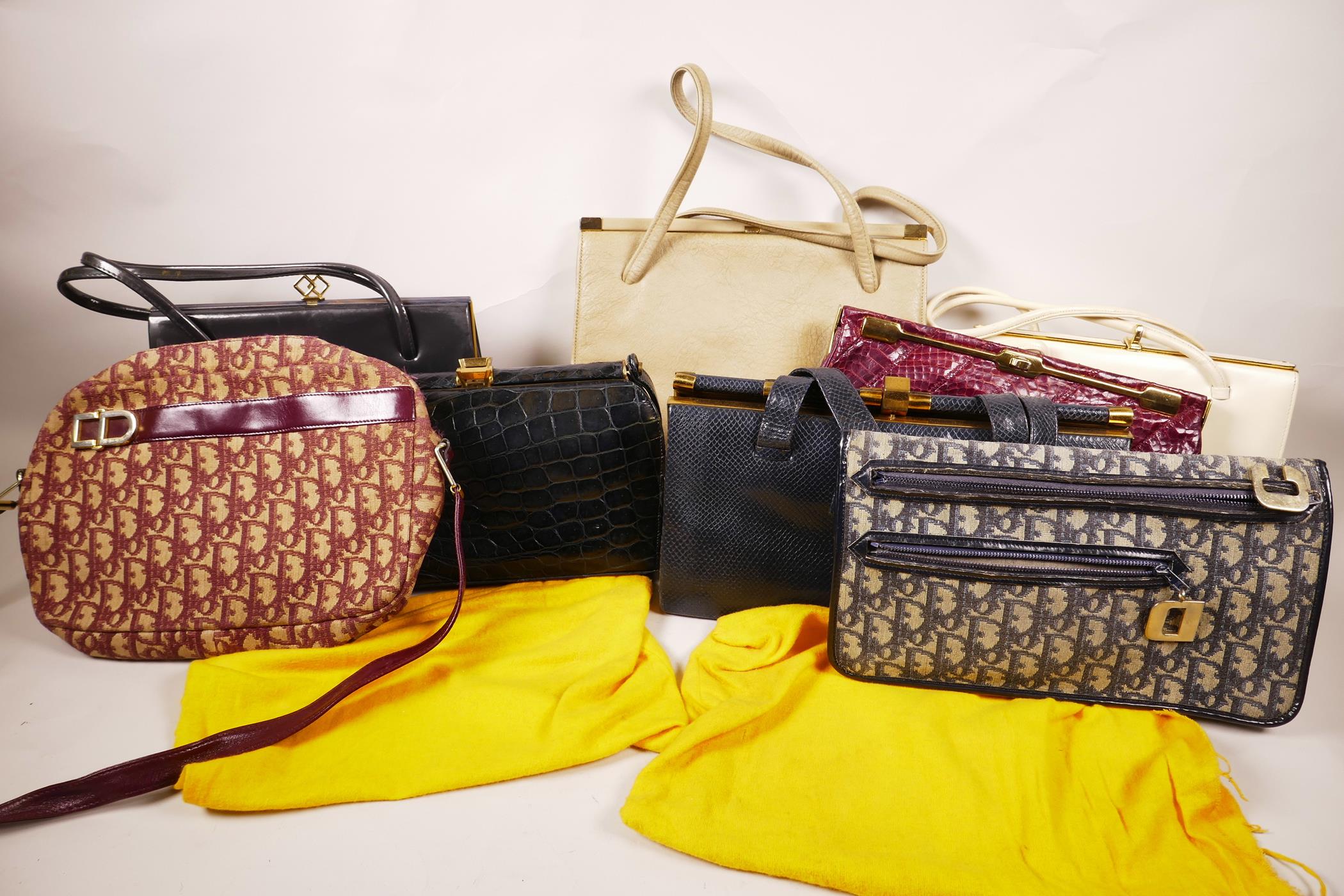 A box of circa twenty vintage designer handbags and purses from the 1960s and 70s, includes some