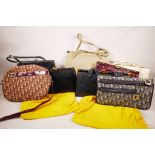 A box of circa twenty vintage designer handbags and purses from the 1960s and 70s, includes some