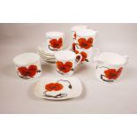 A Wedgwood Susie Cooper 'Corn Poppy' design part tea service in bone china, six teacups, six tea