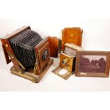 Two mahogany folding plate cameras and other related items, A/F
