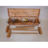 A full size croquet set by Jaques of London with four ash corrigrip mallets etc, in pine box from