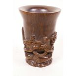 A Chinese faux horn libation cup with carved decoration, 4¼" high