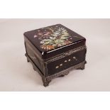 A 1920s amethyst glass and silver plated mounted casket with polychrome enamel floral decoration, 7"