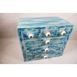 A painted miniature chest of three short over three long drawers with ceramic handles, 13" x 15" x