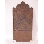 An antique cast iron fire back with raised decoration of a shepherd and flock, 39" x 19"