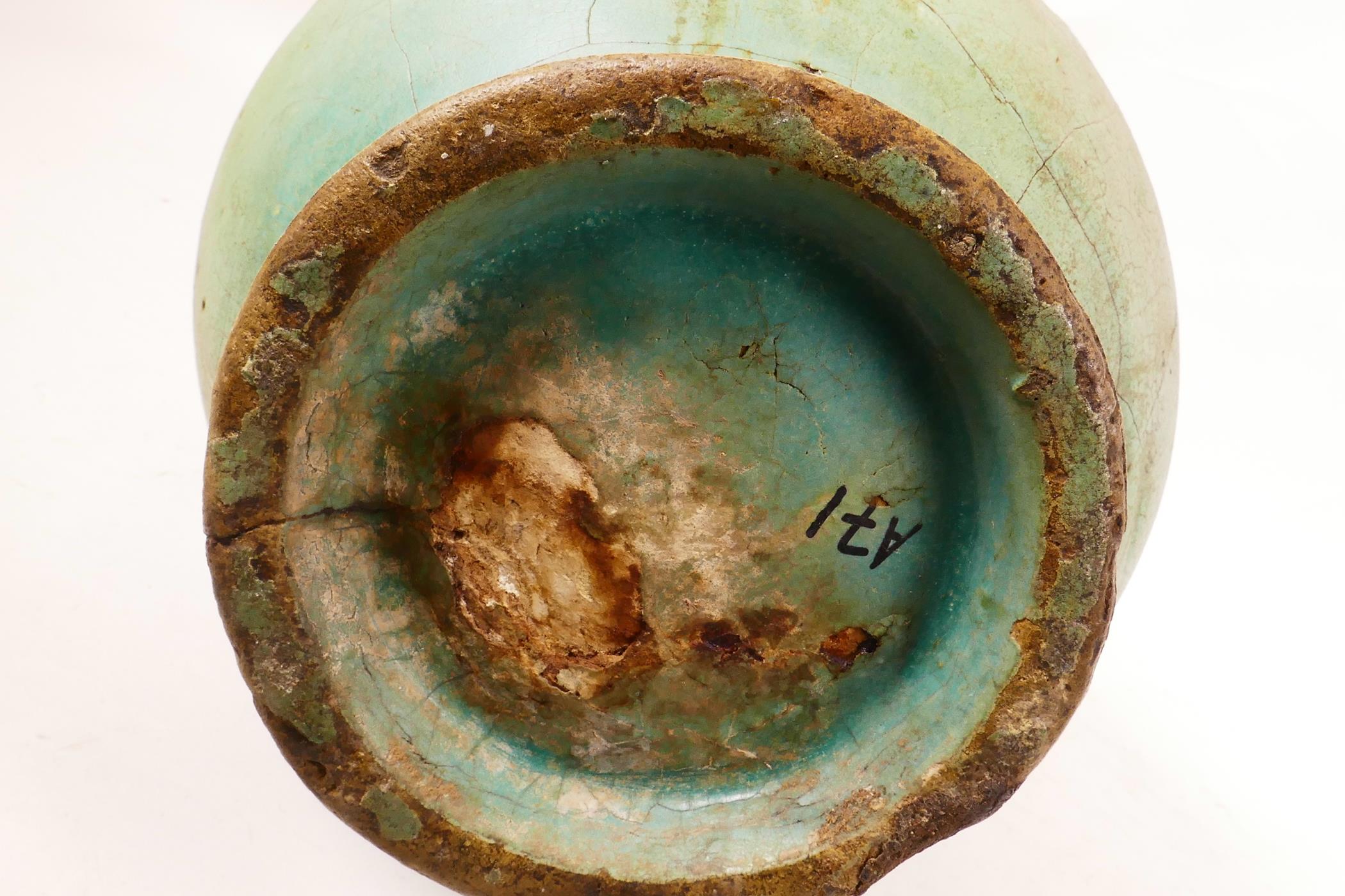 An Eastern pottery two handled vase with a turquoise glaze and copper rim, probably Indian, repair - Image 4 of 6