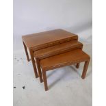 A Gordon Russell teak nest of tables, plaque to underside, largest 27" x 18" x 18" high