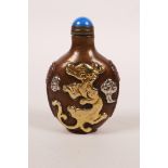 A Chinese copper snuff bottle with raised and silvered dragon decoration, 2½" high