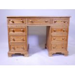 A pine pedestal desk with a leather inset top, 47" x 22", 31½" high