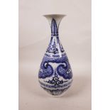 A Chinese blue and white pear shaped vase with scrolling decoration, 11" high