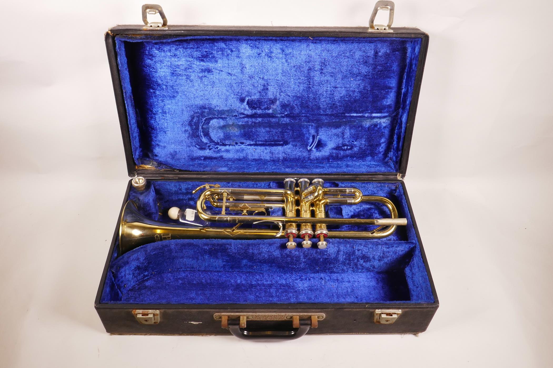 A B&M Champion brass trumpet, in a fitted case, 20" long