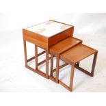 A mid century G-Plan teak tile top nest of tables with a single drawer, 21½ x 17", 23½" high
