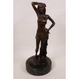 A bronze figurine of a semi-clad girl on a marble base, 12" high