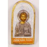 A painted and embossed white metal Orthodox icon, 8" high