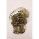 A studio glass ornament in the form of a mask, 6" x 7½"