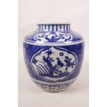 A Chinese blue and white porcelain jar with decorative panels depicting birds and flowers, 6½"