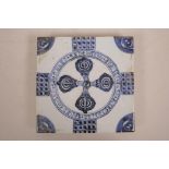 A Chinese blue and white pottery tile decorated with a double vajra pattern, 8" x 8"