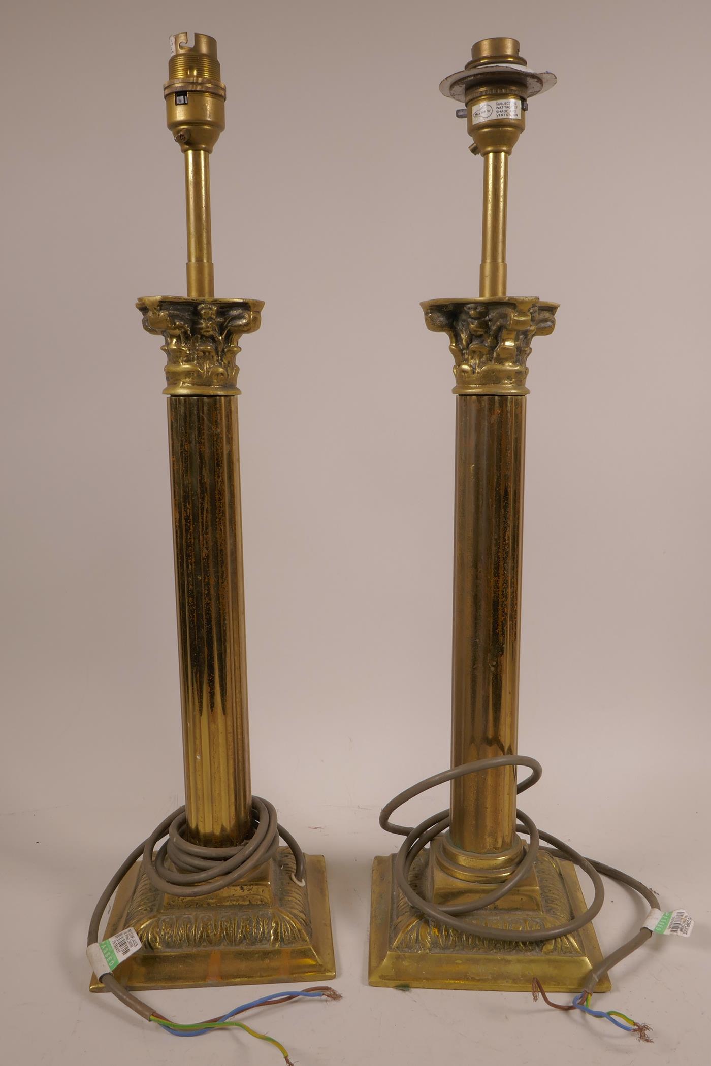 A pair of Corinthian column brass lamps, 19" high x 5" wide