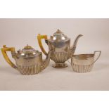 A German silver three piece tea set, marked 800, 946 grams total