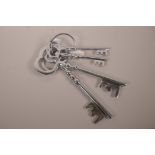 A large set of novelty metal keys, largest 14"