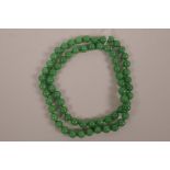 A green hardstone bead necklace, 32" long