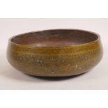 A Kashmiri copper lined papier mache bowl with scrolling decoration painted in enamels, 11" dia