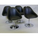 A set of four retro vinyl tub swivel chairs on chrome bases, 31" high