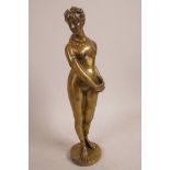 A bronze figurine of a classical female nude , 10" high
