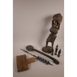 An African hand carved Dogon door lock, together with a South African carved wood Zulu ladle, a