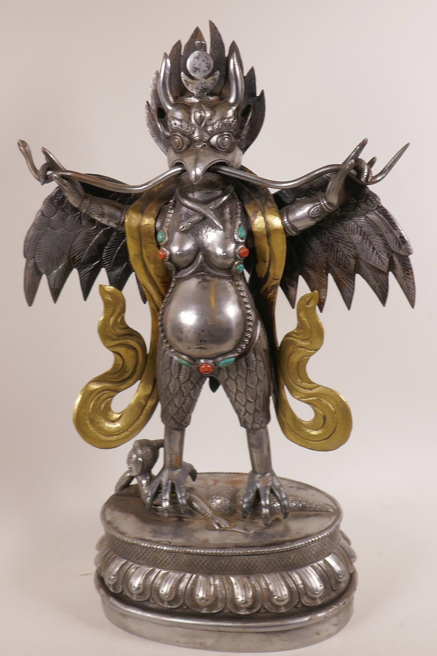 An Asian polished steel and brass figure of the bird deity Garuda, 20" high - Image 2 of 2
