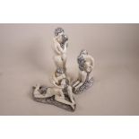 Three composition figurines of nude couples in an embrace, largest 11" high