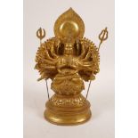 A Sino-Tibetan gilt bronze of a many armed deity, impressed double vajra mark to base, 10½" high
