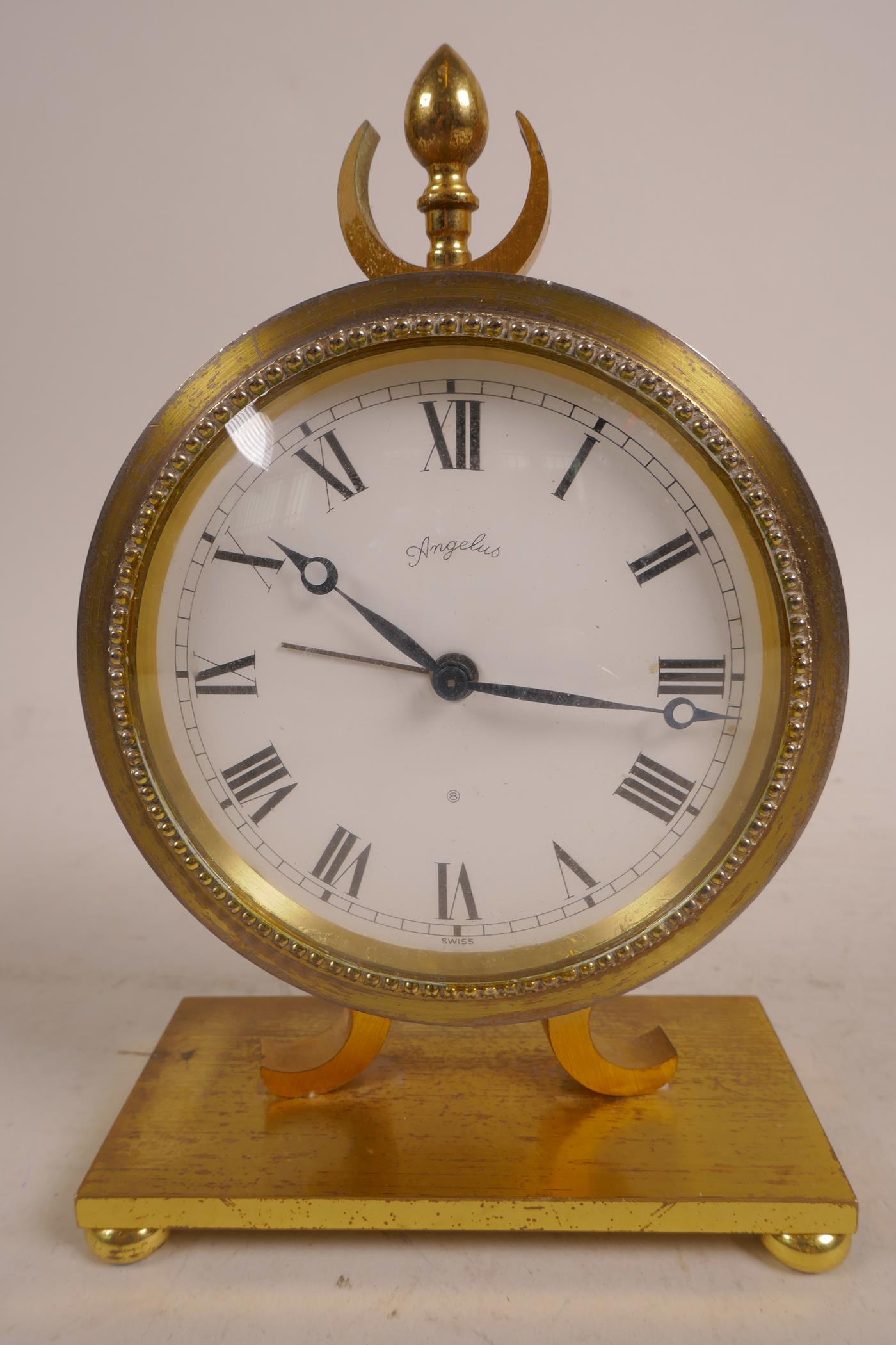 An Angelus Swiss mantel clock in brass, stamped to base number 1178, A/F, 6" high x 4" wide