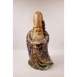 A Japanese ceramic figure of Shou Lao, with polychrome glaze, late C19th/early C20th, 16" high