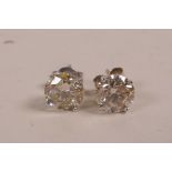 A pair of white gold, diamond stud earrings, approximately 2.1 carats