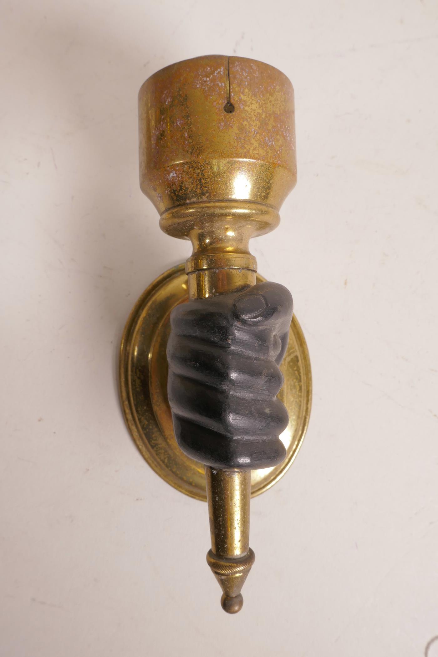 A pair of brass wall lights, with bronze hands clasping the torcheres, 6" high x 3" - Image 3 of 5