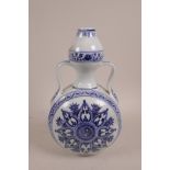A Chinese blue and white porcelain two handled flask with Yin Yang decoration, 6 character mark to