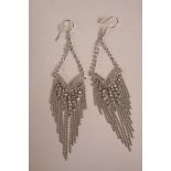 A pair of silver and cubic zirconium drop earrings, 4" drop